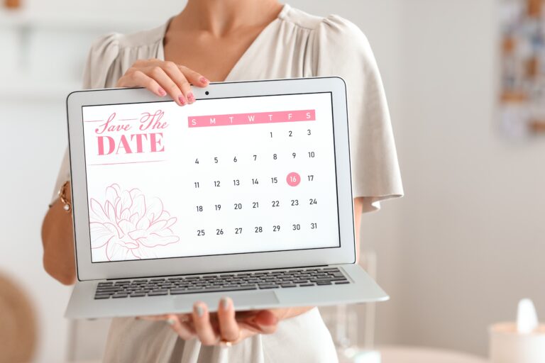 Female,Wedding,Planner,With,Laptop,In,Office,,Closeup